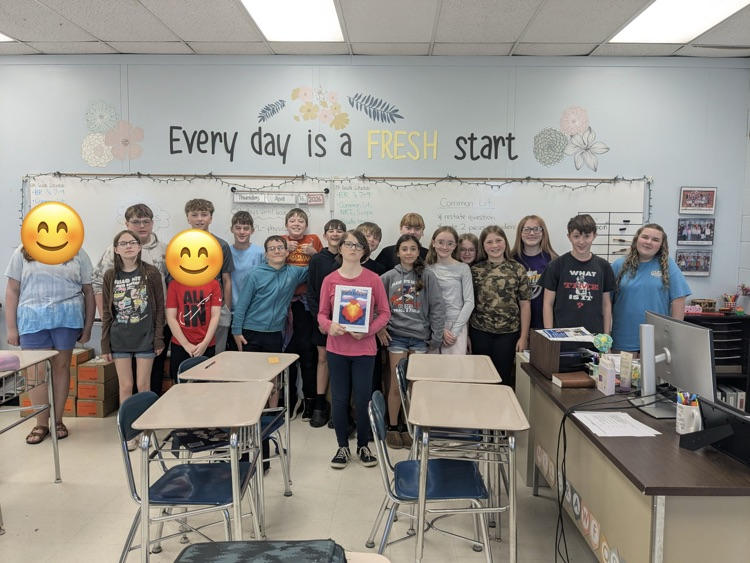 students published their own books in ELA class. posing as a class