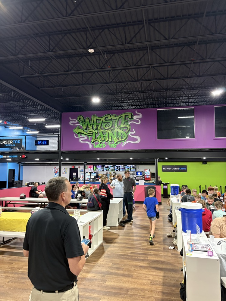 PCMS fifth grade students at The Hive trampoline park in Bridgeport, WV, jumping and playing indoors.