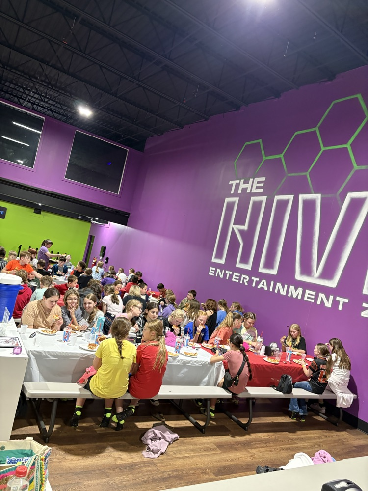 PCMS fifth grade students at The Hive trampoline park in Bridgeport, WV, jumping and playing indoors.