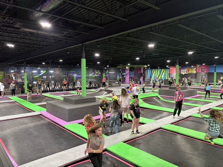 PCMS fifth grade students at The Hive trampoline park in Bridgeport, WV, jumping and playing indoors.