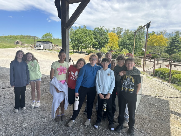 PCMS sixth grade students visiting a farm at Walnut Creek, interacting with animals.