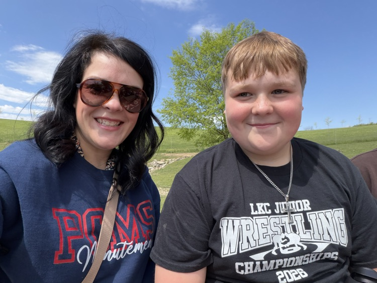 PCMS sixth grade students visiting a farm at Walnut Creek, interacting with animals.