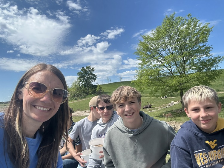 PCMS sixth grade students visiting a farm at Walnut Creek, interacting with animals.
