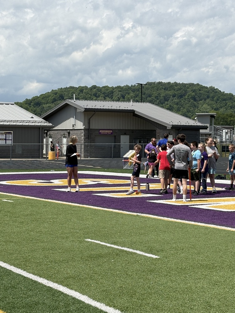 Fifth grade students participating in track and field events during Elementary Track & Field Day.