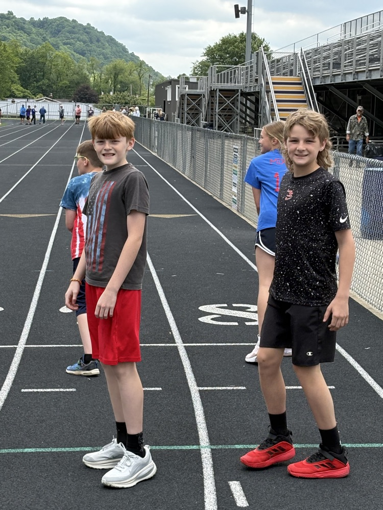 Fifth grade students participating in track and field events during Elementary Track & Field Day.