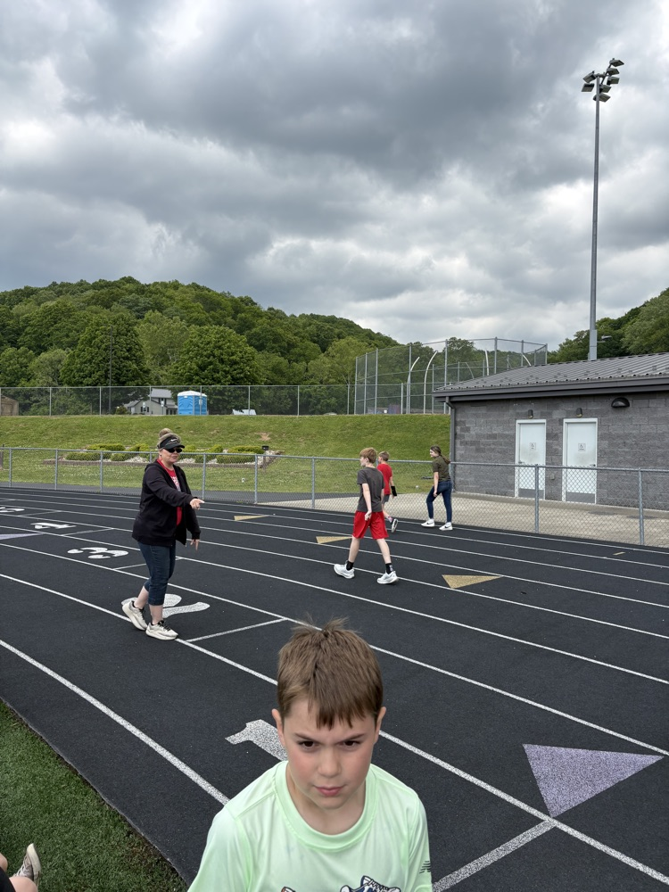 Fifth grade students participating in track and field events during Elementary Track & Field Day.