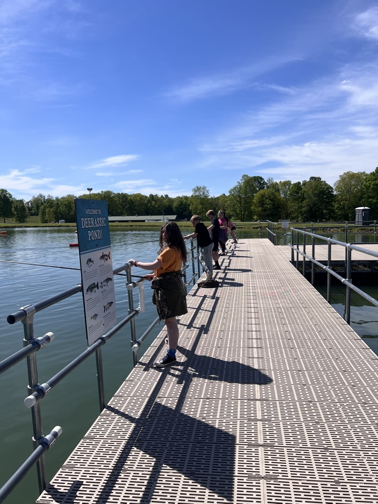 Seventh grade students explore exhibits and outdoor activities during a field trip to Deerassic Park Education Center in Ohio.