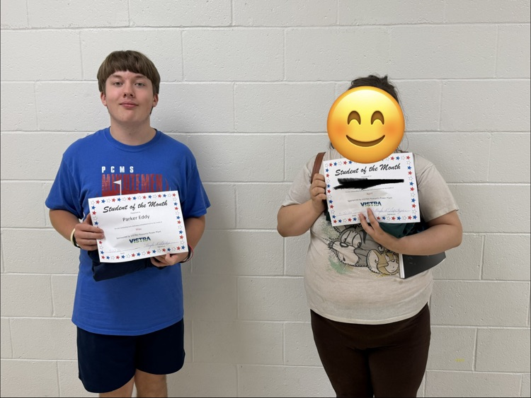 VISTRA Student of the month standing with award