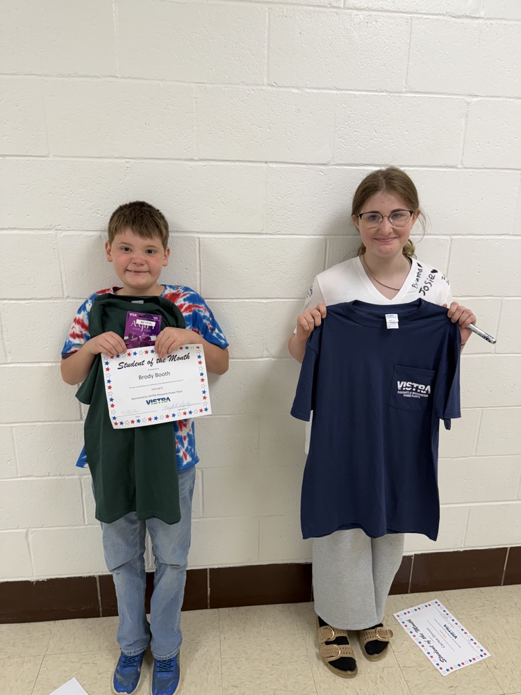VISTRA Student of the month standing with award