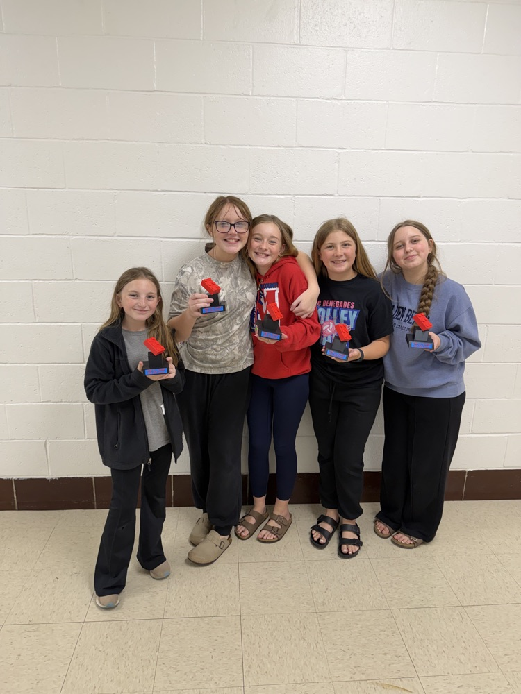 Five students stand together holding awards after being recognized for representing PCMS at the West Virginia FIRST LEGO League Challenge State Tournament.