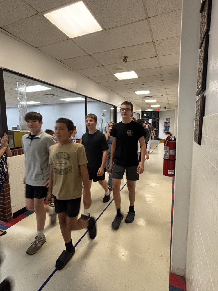 PCMS 8th grade students take their final lap through the school as students and staff line the hallways to cheer them on and celebrate their transition to high school.