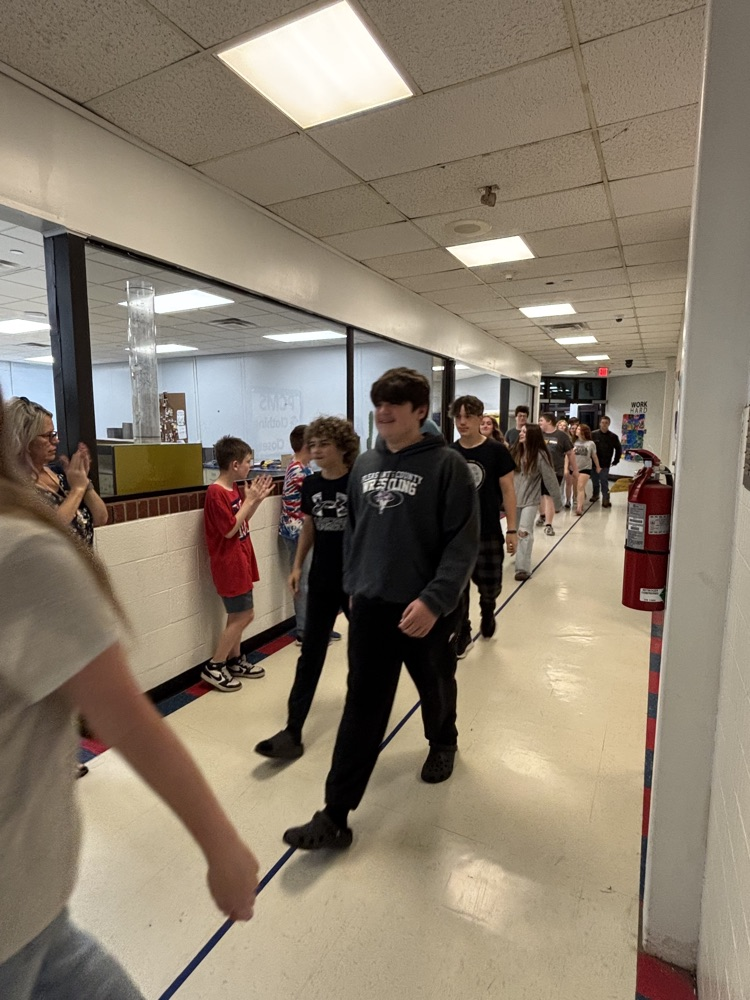 PCMS 8th grade students take their final lap through the school as students and staff line the hallways to cheer them on and celebrate their transition to high school.