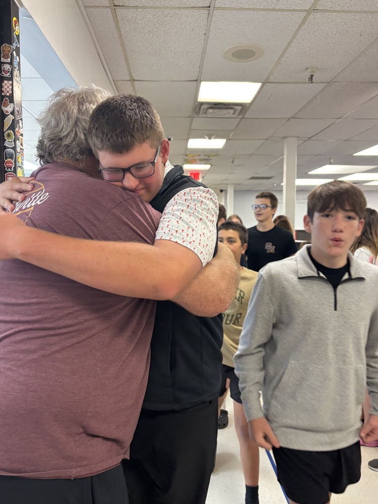 PCMS 8th grade students take their final lap through the school as students and staff line the hallways to cheer them on and celebrate their transition to high school.