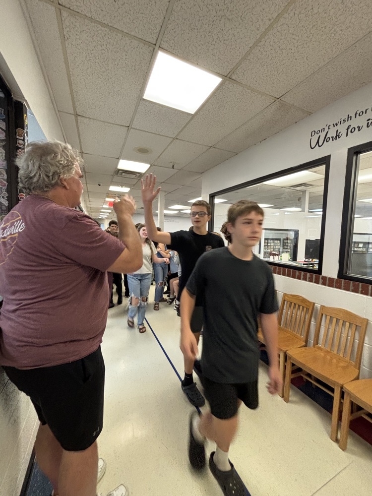 PCMS 8th grade students take their final lap through the school as students and staff line the hallways to cheer them on and celebrate their transition to high school.