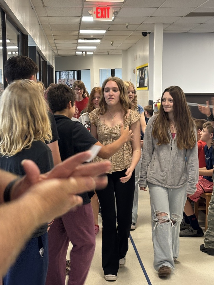 PCMS 8th grade students take their final lap through the school as students and staff line the hallways to cheer them on and celebrate their transition to high school.