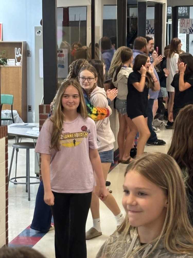 PCMS 8th grade students take their final lap through the school as students and staff line the hallways to cheer them on and celebrate their transition to high school.