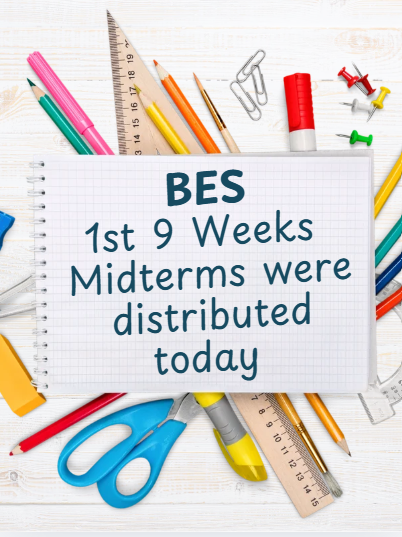 A white spiral notebook rests on a light wooden desk surrounded by colorful school supplies, including pencils, rulers, scissors, glue, paper clips, and push pins. Blue text on the notebook reads: "BES 1st 9 Weeks Midterms were distributed today."