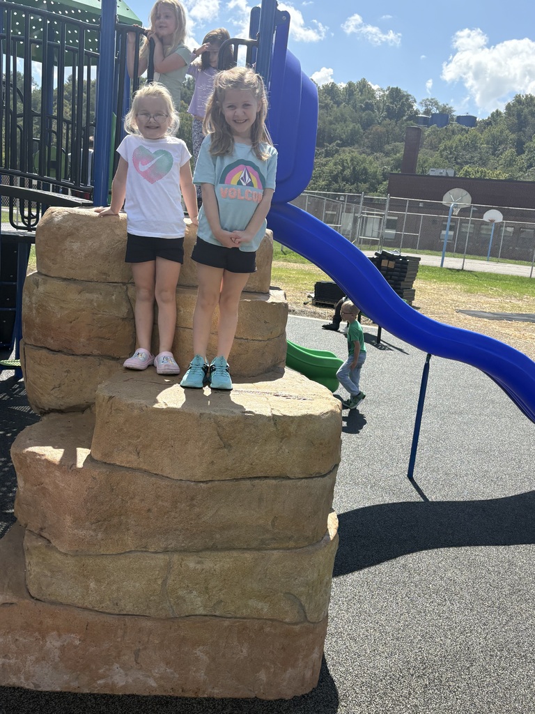 Photos from the ribbon-cutting celebration at Belmont Elementary School for the new Pre-K and Kindergarten–4th Grade playgrounds. Students are pictured exploring and enjoying the new playground equipment with excitement and smiles. The celebration highlights the new playgrounds and the community support that helped make the project possible.