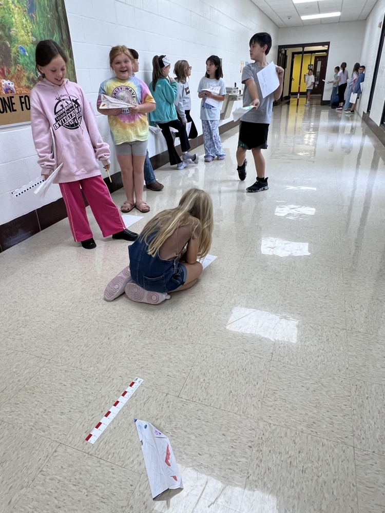 Fourth grade students designed airplanes while practicing measurement and converting feet to yards.