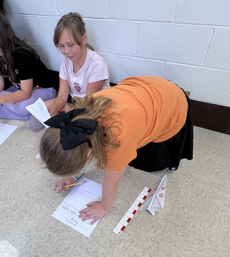 Fourth grade students designed airplanes while practicing measurement and converting feet to yards.