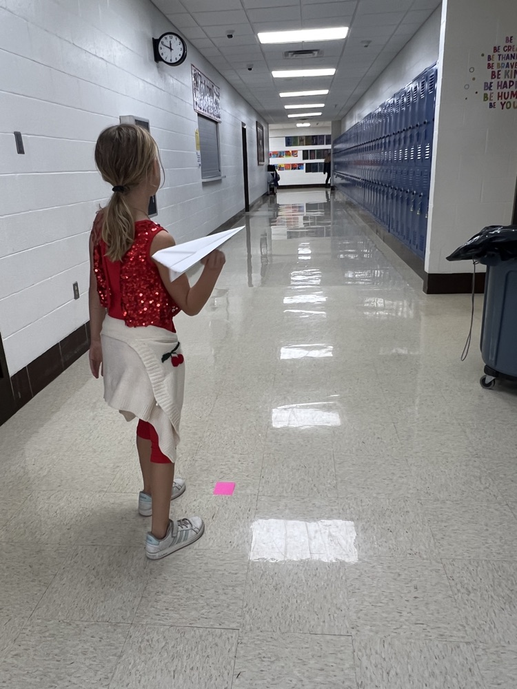 Fourth grade students designed airplanes while practicing measurement and converting feet to yards.