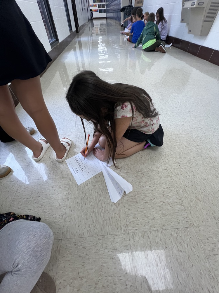 Fourth grade students designed airplanes while practicing measurement and converting feet to yards.