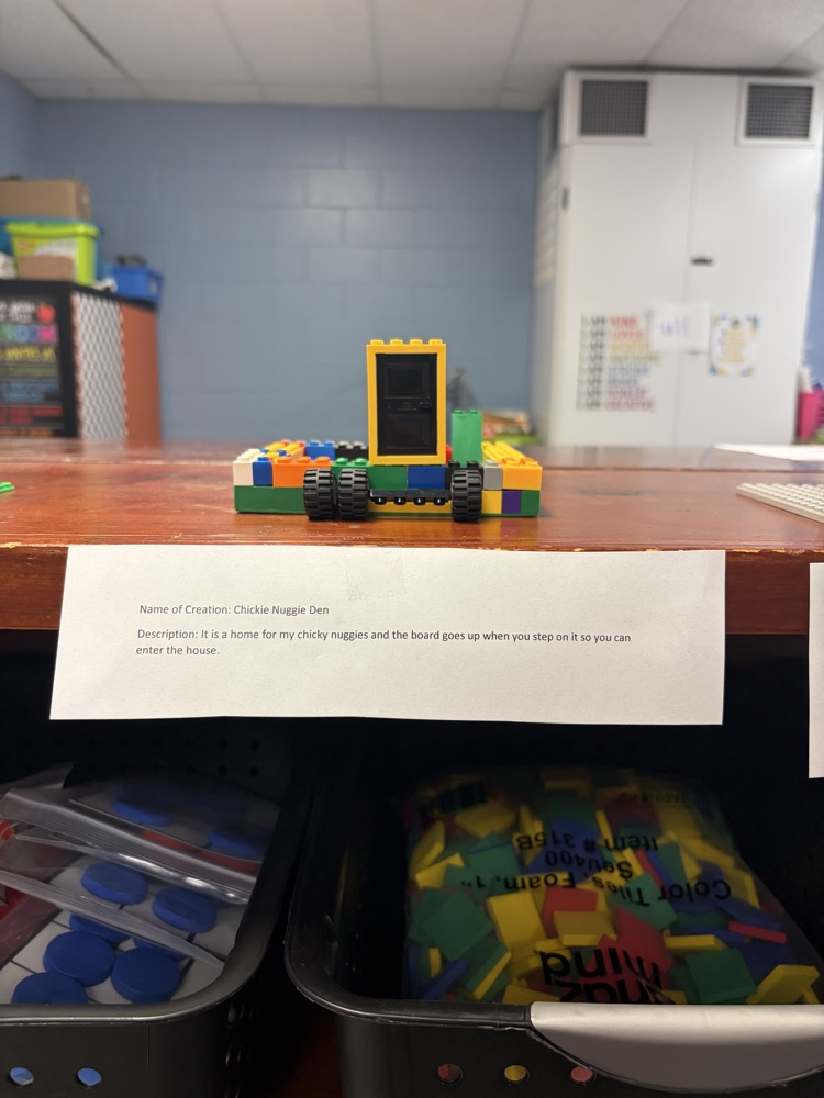Fourth-grade students complete a mystery LEGO STEAM challenge, building unique creations and competing in a student-voted display.