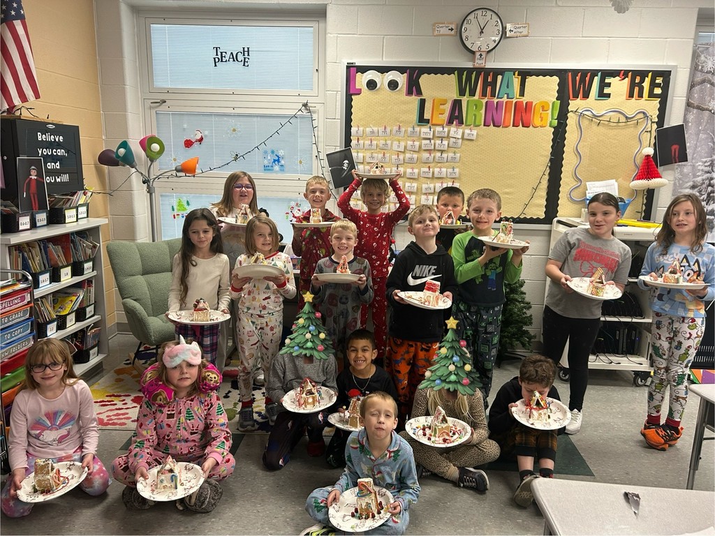 students decorate gingerbread houses