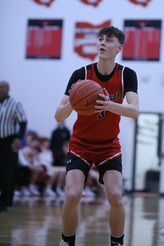 student with basketball