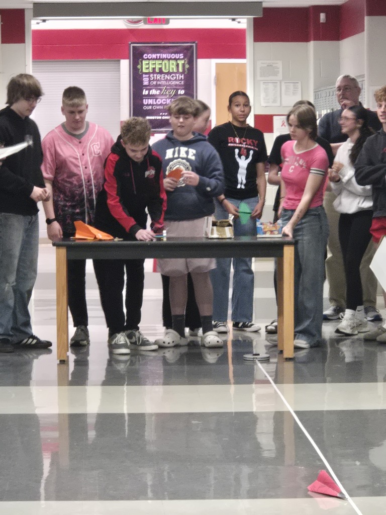 students building paper airplanes