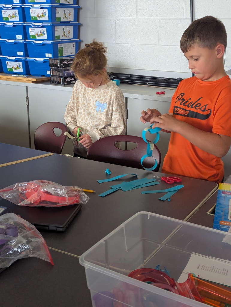 students making paper chain in computer class