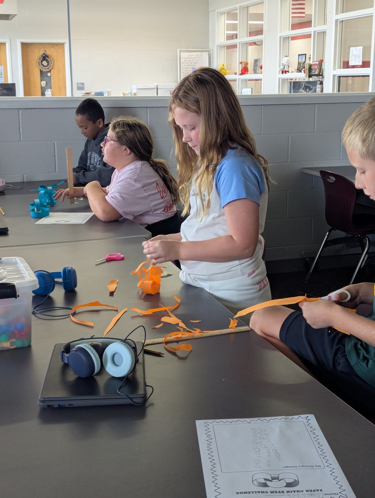 students making paper chain in computer class
