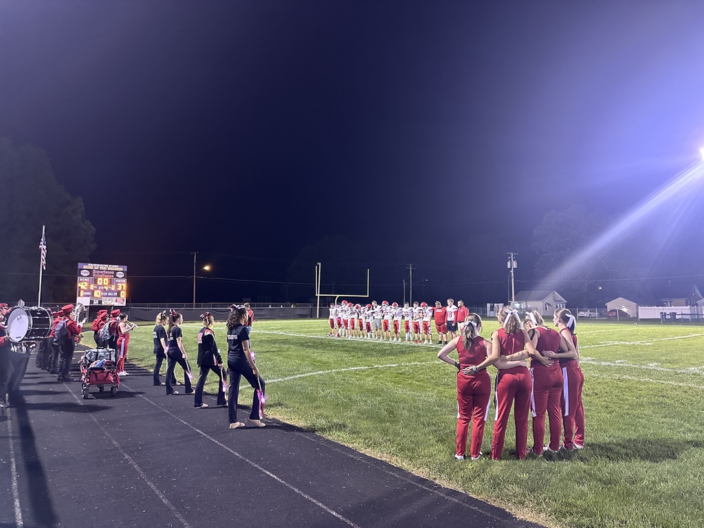 football cheer, players and band