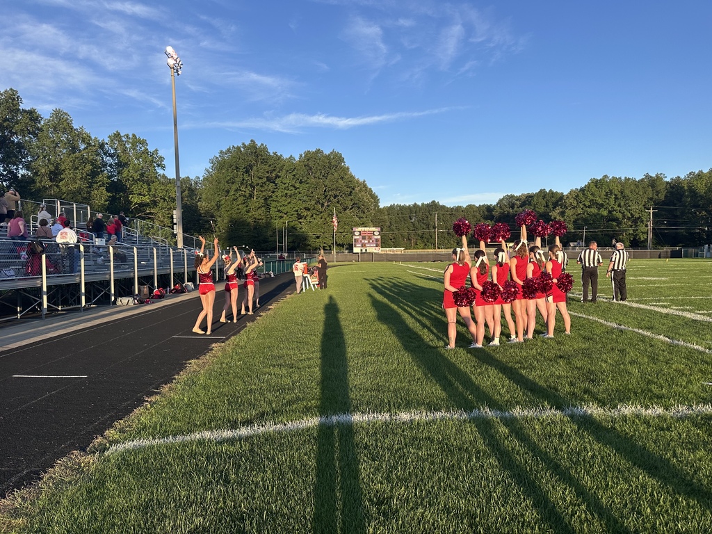 football cheer, players and band