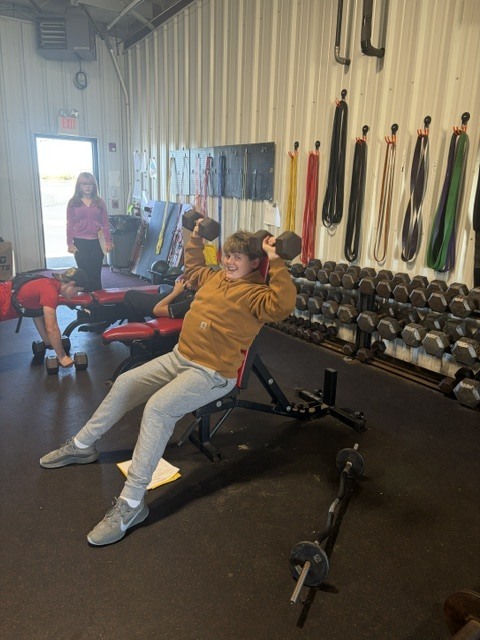 student with weights