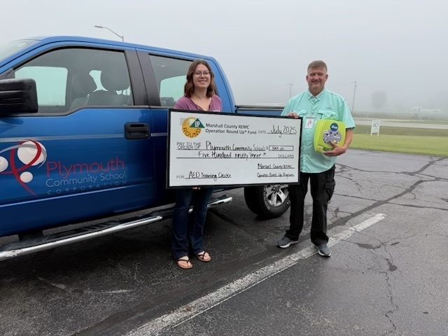 ward byers with a operation round up donation from REMC