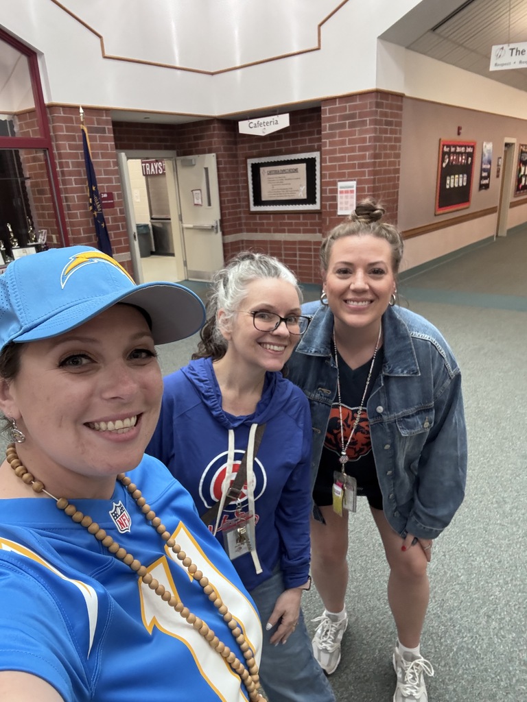 Mrs. Zentz (principal), Mrs. Travis (assistant principal) and Mrs. Horvath (art teacher) representing their favorite sports teams!