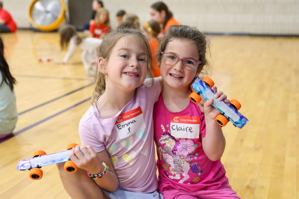 Two students pose and smile at Camp Invention.