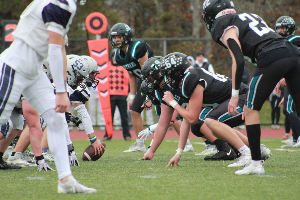 North vs. South football players lined up on the field.