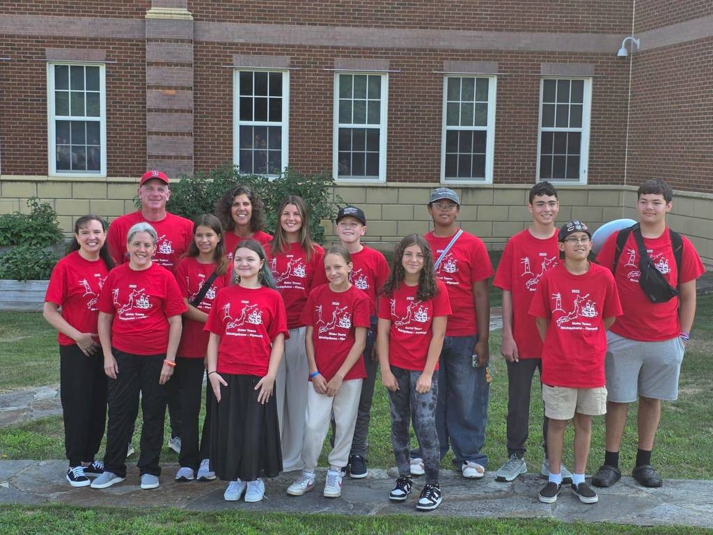Students and chaperones wear matching red t-shirts before their trip to Shichigahama.