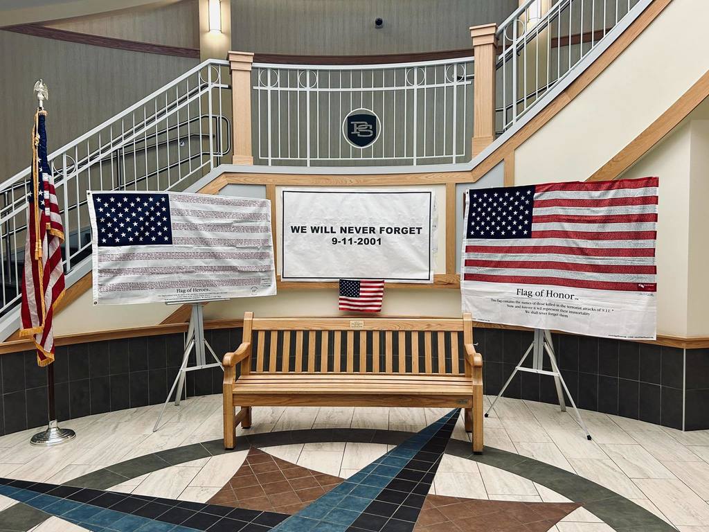 US flags presented in the lobby of Plymouth South High School for 9/11 Remembrance