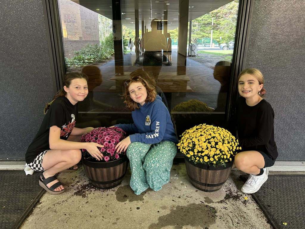 Students planted mums around the campus at Plymouth Community Intermediate School.