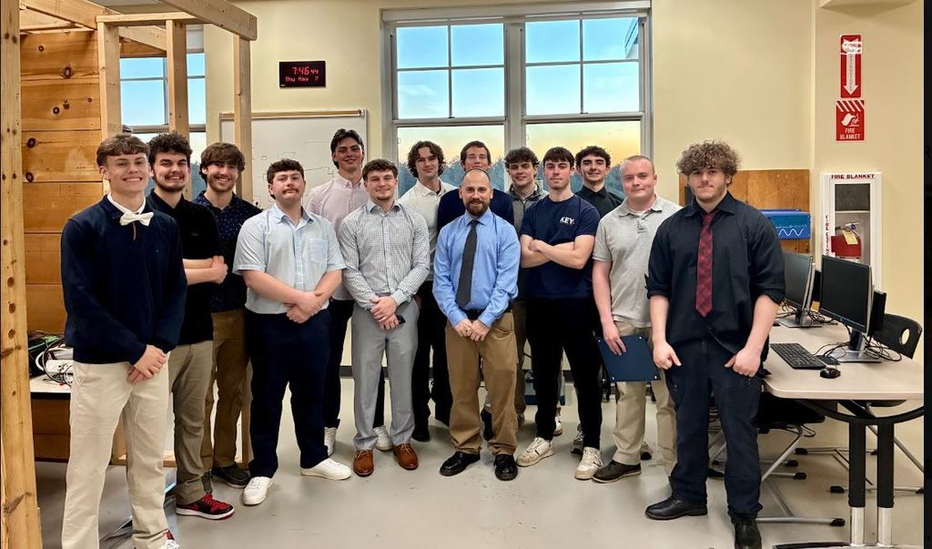 photo of electrical students and teacher