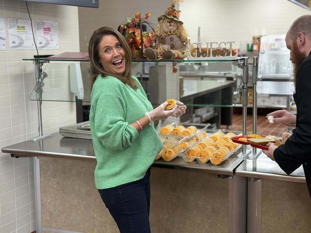 Staff helps serve lunch