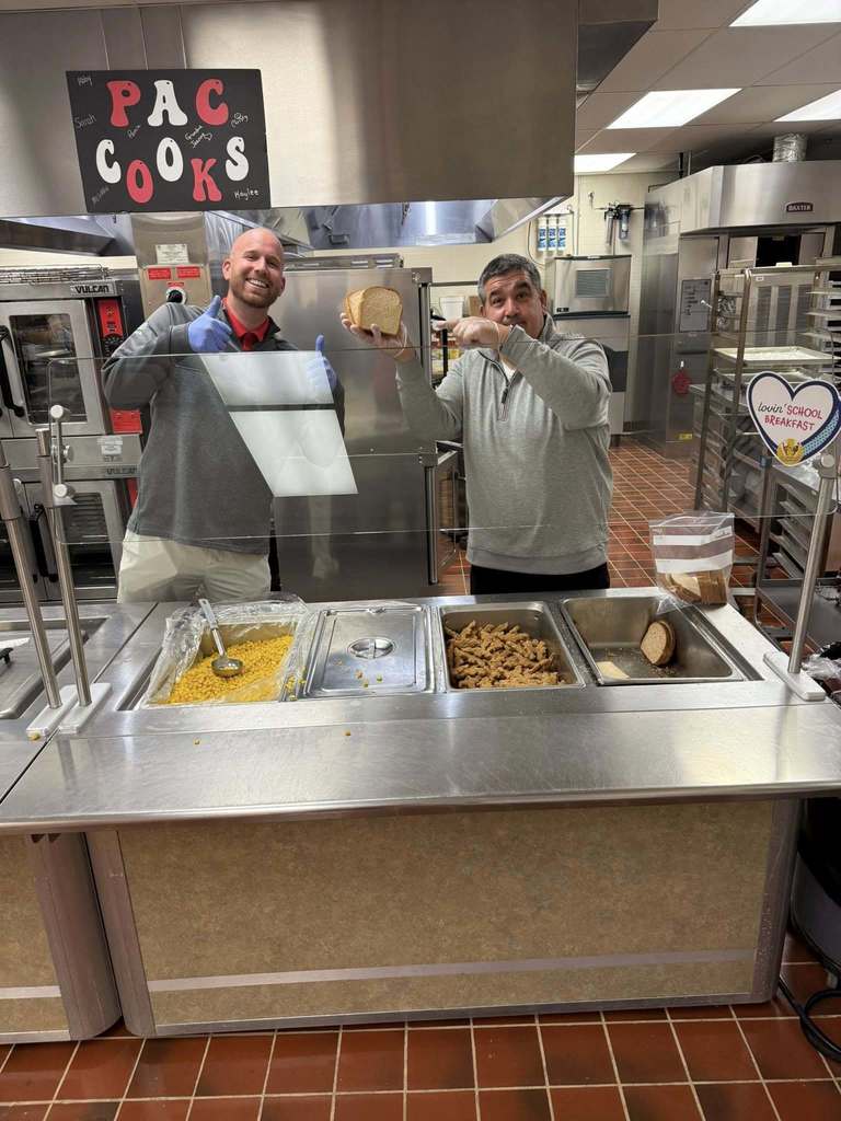 Staff helps serve lunch