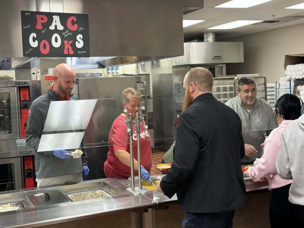 Staff helps serve lunch