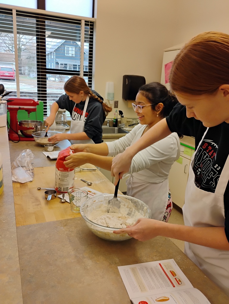 Students stir up bread