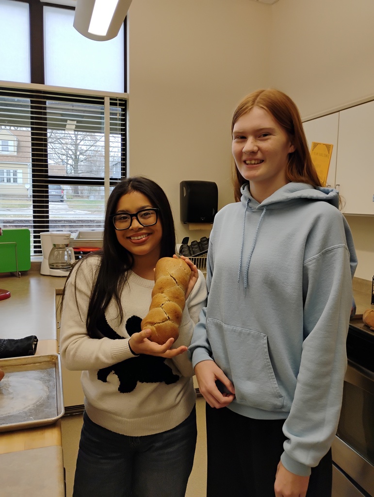 girls with a braided loaf of bread