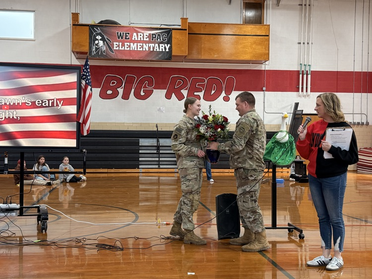 Chief Alex gives Miss Ford flowers from PAC staff
