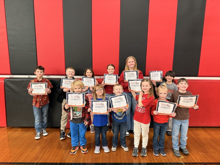 honesty award winners hold their awards